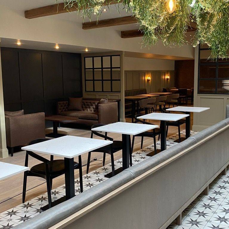 Cafe interior with patterned tiled floor kept clean under contract
